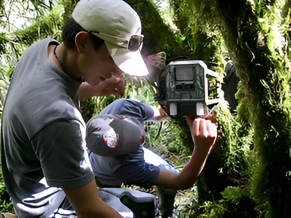 Setting up a camera trap.